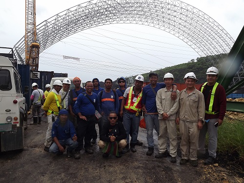 Engineers and workers take photos

